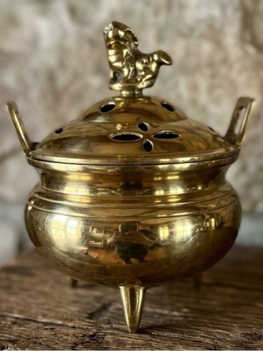 Antique Chinese brass incense burner
foo dog finial on the lid
three tripod feet